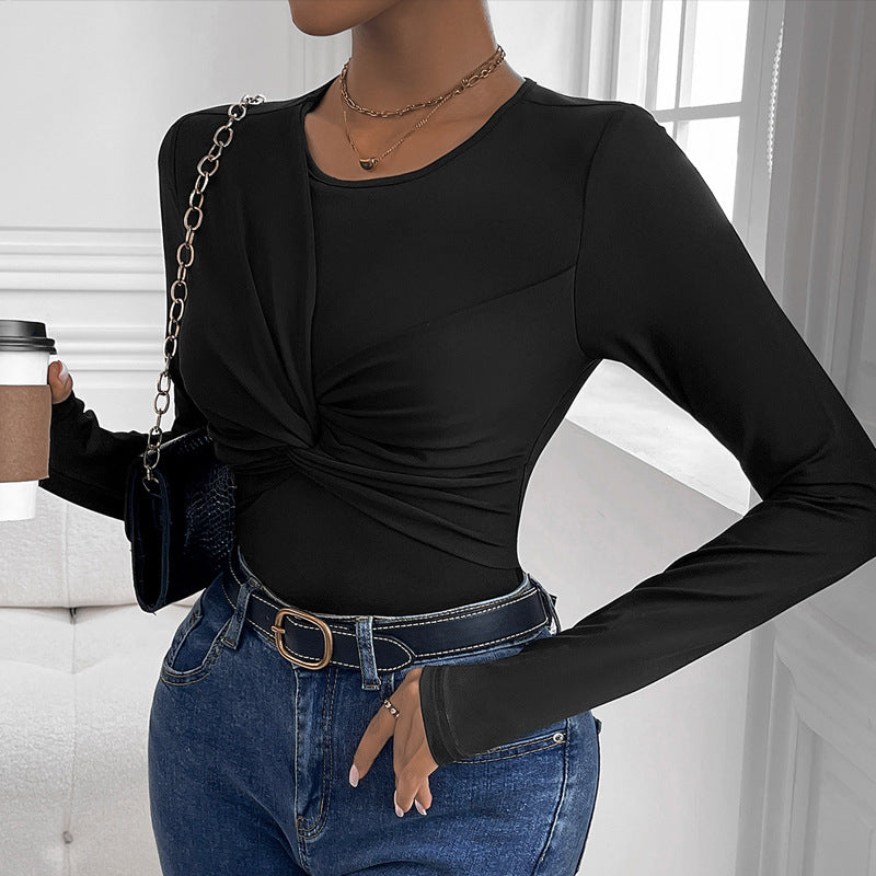 Solid black body with a twist collar and minimalist style.