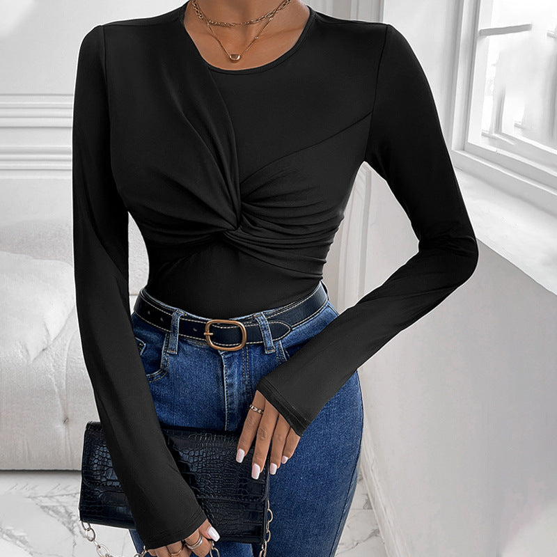Solid black body with a twist collar and minimalist style.