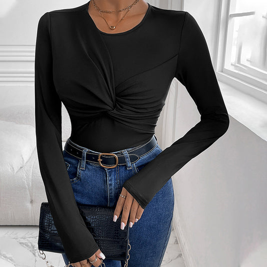 Solid black body with a twist collar and minimalist style.